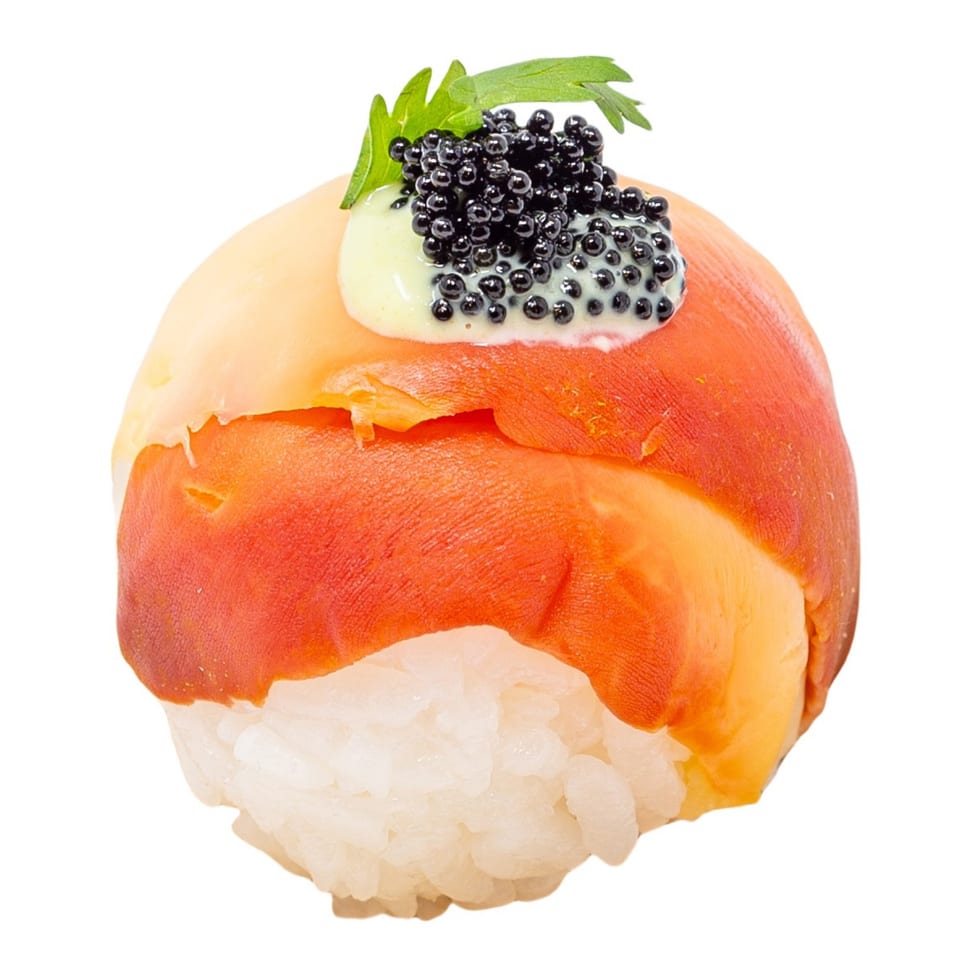 Bloop Bloop sushi with orange fish, black caviar, green sauce, and a parsley garnish.